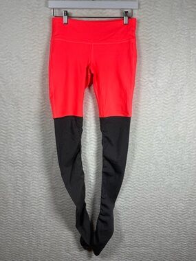 ALO Goddess High Waist Yoga two tone leggings. Neon Coral/Orange top grey under